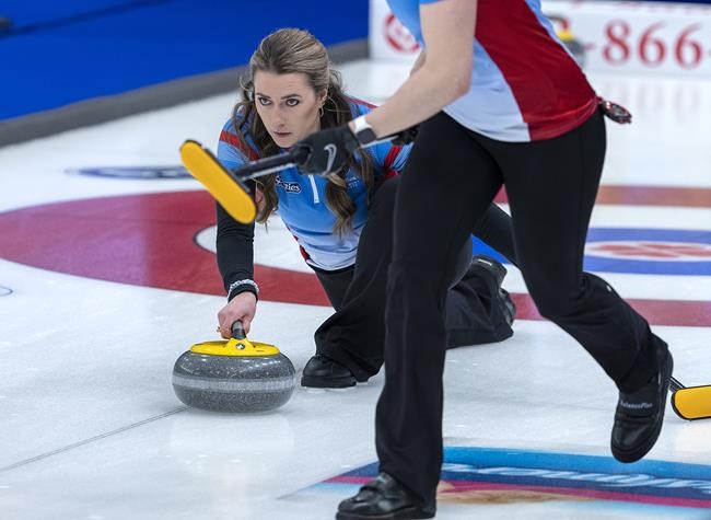 Wild Card 3 skip Emma Miskew delivers a rock as they play Northern Ontario at the Scotties Tournament of Hearts at Fort William Gardens in Thunder Bay, Ont., Sunday, Jan. 30, 2022. THE CANADIAN PRESS/Andrew Vaughan