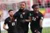 Canada's Cyle Larin, 17, celebrates his goal against the USA with teammate Richie Laryea, 22, during a men's first half World Cup Qualifier at sold out Tim Hortons Field in Hamilton, Ontario on Sunday Jan. 30, 2022. THE CANADIAN PRESS/Nathan Denette