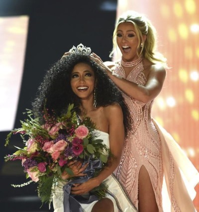 FILE - Miss North Carolina Cheslie Kryst gets crowned by last year's winner Sarah Rose Summers after winning the 2019 Miss USA final competition in the Grand Theatre in the Grand Sierra Resort in Reno, Nev., on May 2, 2019. Kryst, a correspondent for the entertainment news program “Extra,” has died. Police said the 30-year-old Kryst jumped from a Manhattan apartment building. She was pronounced dead at the scene Sunday morning, Jan. 30, 2022. Her family confirmed her death in a statement. (Jason Bean/The Reno Gazette-Journal via AP, File)