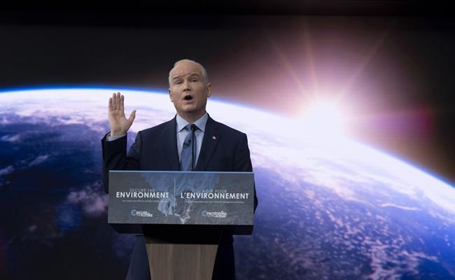 Leader of the Opposition Erin O'Toole speaks about climate change during an announcement at an event in Ottawa, Thursday April 15, 2021. A Conservative riding association has launched a petition against leader Erin O'Toole's decision to introduce a carbon tax. THE CANADIAN PRESS/Adrian Wyld