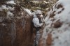 Ukrainian servicemen stand in a trench at a frontline position in the Donetsk region, eastern Ukraine, Monday, Jan. 31, 2022.&nbsp;All parties in the House of Commons agree that Canada must stand in solidarity with Ukraine but they're showing sharp divisions over how best to do that. THE CANADIAN PRESS/AP-Vadim Ghirda