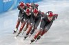 Canada’s Courtney Sarault, right, and Kim Boutin leads the team around the track during a short track speedskating practice session at the 2022 Winter Olympics Kim Boutin in Beijing on Tuesday, February 1, 2022. THE CANADIAN PRESS/Paul Chiasson
