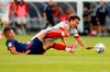 Chicago Fire defender Mauricio Pineda, left slide-tackles Toronto FC forward Tsubasa Endoh during the first half of an MLS soccer match, Saturday, July 24, 2021, in Chicago. THE CANADIAN PRESS/AP/Shafkat Anowar
