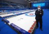 Head ice technician Hans Wuthrich, from Gimli, Man., stands beside the curling sheets at the Ice Cube Wednesday, February 2, 2022 at the 2022 Winter Olympics in Beijing. THE CANADIAN PRESS/Ryan Remiorz