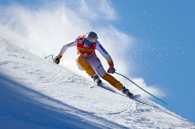 FILE- Slovakia's Petra Vlhova speeds down the course during an alpine ski, women's World Cup downhill race, in Zauchensee, Austria, Saturday, Jan. 15, 2022. (AP Photo/Giovanni Maria Pizzato, File)