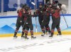 Team Canada forward Sarah Fillier (10), centre, celebrates with teammates after scoring her first goal against Switzerland during first period women's ice hockey action Thursday, February 3, 2022 at the 2022 Winter Olympics in Beijing. THE CANADIAN PRESS/Ryan Remiorz