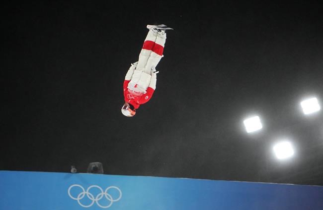 Canada's Mikael Kingsbury soars through the air during the men's moguls qualification round at the Beijing Winter Olympics in Zhangjiakou, China, on Thursday, Feb. 3, 2022. THE CANADIAN PRESS/Sean Kilpatrick