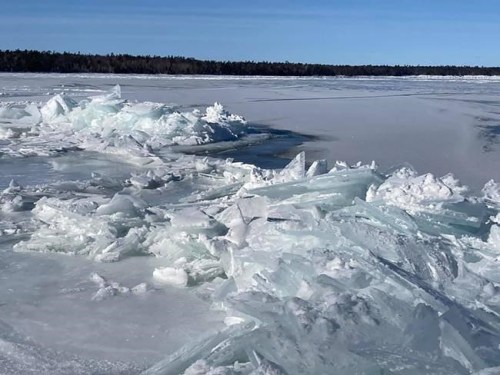 Ice builds on Lake Michigan along the shore at Newport State Park in Wisconsin, Feb. 15, 2021. Scientists will venture onto frozen surfaces of Lake Michigan and other Great Lakes this month to collect frigid water samples in a wide-ranging quest for information about ways that climate change is affecting the lakes and creatures that live in them. (AP Photo/ Roger Schneider)