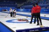 Canada's John Morris and Rachel Homan, sweep the ice during the mixed doubles curling match against China, at the 2022 Winter Olympics, Friday, Feb. 4, 2022, in Beijing. (AP Photo/Nariman El-Mofty)