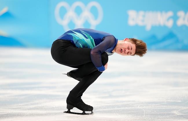 Canada's Roman Sadovsky competes during the men's singles short program portion of the figure skating team event at the 2022 Winter Olympics in Beijing on Friday, February 4, 2022. THE CANADIAN PRESS/Paul Chiasson