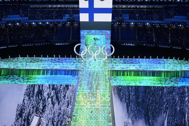 Athletes from Finland arrive during the opening ceremony of the 2022 Winter Olympics, Friday, Feb. 4, 2022, in Beijing. (AP Photo/Jeff Roberson)