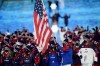 Brittany Bowe and John Shuster, of the United States, leads their team in during the opening ceremony of the 2022 Winter Olympics, Friday, Feb. 4, 2022, in Beijing. (AP Photo/David J. Phillip)