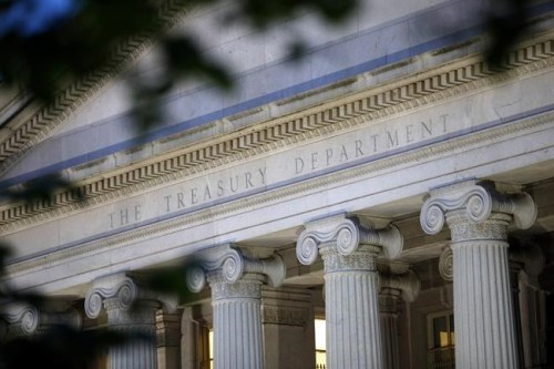 FILIE - This June 6, 2019, photo, shows the U.S. Treasury Department building at dusk in Washington. Fine art isn't just nice to look at. It's also attractive to criminals trying to launder money, finance terrorism and trade illegal drugs and arms. The agency issued a report on Feb. 4, 2022, recommending that financial firms and art dealers set up an information-sharing database to track how sales of fine art are linked to bad actors who make anonymous purchases. (AP Photo/Patrick Semansky, File)