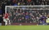 Manchester United's Anthony Elanga fails to score from the penalty spot during the English FA Cup fourth round soccer match between Manchester United and Middlesbrough at Old Trafford stadium in Manchester, England, Friday, Feb. 4, 2022. (AP Photo/Jon Super)