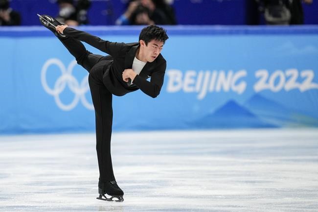 Nathan Chen, of the United States, competes during the men's singles short program team event in the figure skating competition at the 2022 Winter Olympics, Friday, Feb. 4, 2022, in Beijing. (AP Photo/Bernat Armangue)