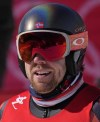 Aleksander Aamodt Kilde, of Norway, looks up as he stands in the finish area after completing a men's downhill training run at the 2022 Winter Olympics, Saturday, Feb. 5, 2022, in the Yanqing district of Beijing. The final men's downhill training was cancelled due to high winds. (AP Photo/Luca Bruno)