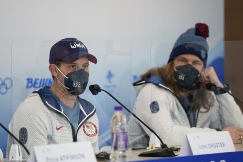 U.S. men's curling team's John Shuster, left, and Matt Hamilton attend a news conference at the 2022 Winter Olympics, Saturday, Feb. 5, 2022, in Beijing. (AP Photo/Jae C. Hong)