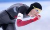 Isabelle Weidemann, of Canada, rounds the oval to win the bronze medal in the women's 3,000 metre speedskating race at the 2022 Winter Olympics in Beijing on Saturday, February 5, 2022. THE CANADIAN PRESS/Paul Chiasson