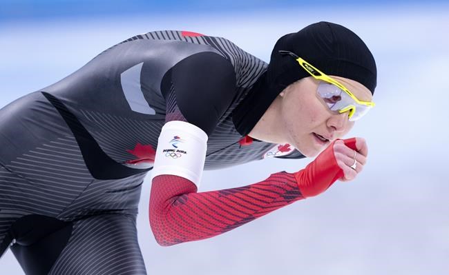 Isabelle Weidemann, of Canada, rounds the oval to win the bronze medal in the women's 3,000 metre speedskating race at the 2022 Winter Olympics in Beijing on Saturday, February 5, 2022. THE CANADIAN PRESS/Paul Chiasson