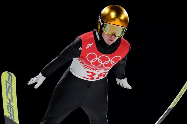 Ema Klinec, of Slovenia, soars through the air during the women's normal hill individual ski jumping trial round at the 2022 Winter Olympics, Saturday, Feb. 5, 2022, in Zhangjiakou, China. (AP Photo/Andrew Medichini)