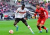 Stuttgart's Silas, left, gets to the ball before Frankfurt's Christopher Lenz during a German Bundesliga soccer match between VfB Stuttgart and Eintracht Frankfurt in Stuttgart, Germany, Saturday, Feb.5, 2022. (Silas Stein/dpa via AP)