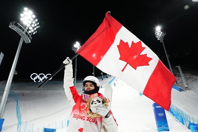 Mikael Kingsbury, of Canada, celebrates his silver medal winning run at men's moguls finals at the 2022 Winter Olympics in Zhangjiakou, China on Saturday, February 5, 2022. THE CANADIAN PRESS/Sean Kilpatrick