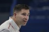 John Morris, of Canada, reacts after being told he didn't wipe his stone during the mixed doubles curling match against Britain at the Beijing Winter Olympics Thursday, Feb. 3, 2022, in Beijing. (AP Photo/Brynn Anderson)