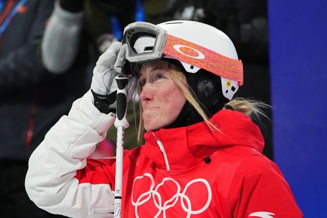 Justine Dufour-Lapointe, of Canada, reacts after her run during women's moguls finals at the Beijing Winter Olympics in Zhangjiakou, China, on Sunday, Feb. 6, 2022. Dufour-Lapointe and Sofiane Gagnon both crashed in the women’s moguls first final at the Beijing Olympics. THE CANADIAN PRESS/Sean Kilpatrick