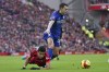 Liverpool's Luis Diaz, left, is knocked off the ball by Cardiff City's Perry Ng during the FA Cup fourth round soccer match between Liverpool and Cardiff City at Anfield stadium in Liverpool, England, Sunday, Feb. 6, 2022. (AP Photo/Jon Super)