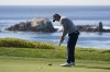 Jordan Spieth makes a birdie putt on the fourth green of the Pebble Beach Golf Links during the final round of the AT&T Pebble Beach Pro-Am golf tournament in Pebble Beach, Calif., Sunday, Feb. 6, 2022. (AP Photo/Eric Risberg)