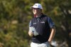 Tom Hoge looks over the fourth green of the Pebble Beach Golf Links during the final round of the AT&T Pebble Beach Pro-Am golf tournament in Pebble Beach, Calif., Sunday, Feb. 6, 2022. (AP Photo/Tony Avelar)