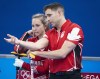 Canada’s Rachel Homan and John Morris discuss a shot during preliminary round mixed curling against Czech Republic&nbsp;at the 2022 Winter Olympics in Beijing, Sunday, Feb. 6, 2022.&nbsp;Canada's mixed doubles curling team is making an early exit at the Beijing Olympics.THE CANADIAN PRESS/Ryan Remiorz