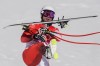 Beat Feuz, of Switzerland, kicks his ski after finishing the men's downhill at the 2022 Winter Olympics, Monday, Feb. 7, 2022, in the Yanqing district of Beijing. (AP Photo/Mark Schiefelbein)