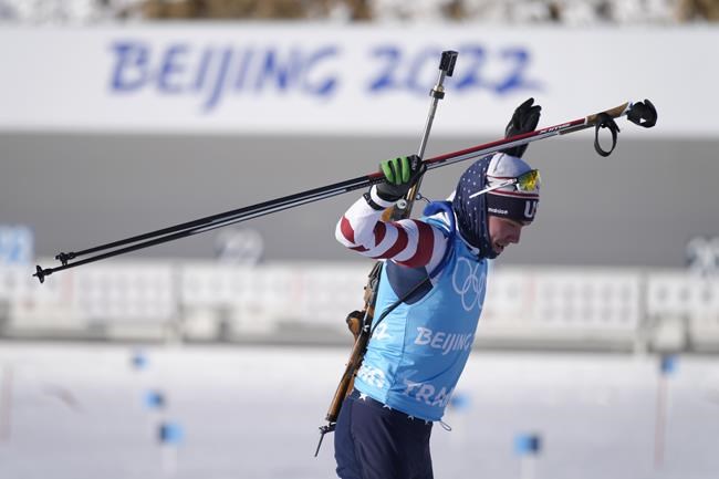 A member of the United States team leaves the target shooting area during practice at the 2022 Winter Olympics, Sunday, Feb. 6, 2022, in Zhangjiakou, China. (AP Photo/Kirsty Wigglesworth)
