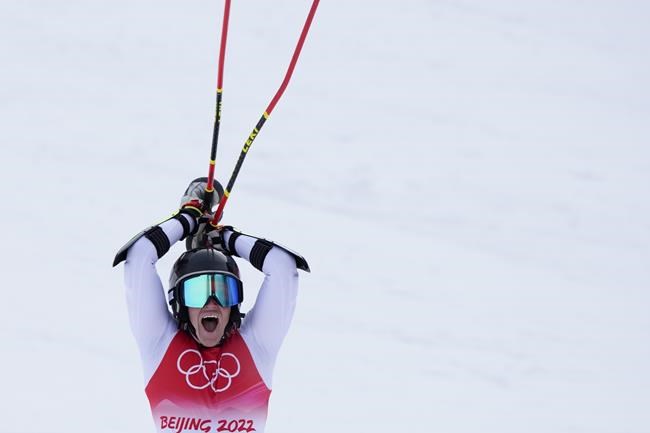 Sara Hector of Sweden celebrates winning the gold medal in women's giant slalom at the 2022 Winter Olympics, Monday, Feb. 7, 2022, in the Yanqing district of Beijing. (AP Photo/Mark Schiefelbein)