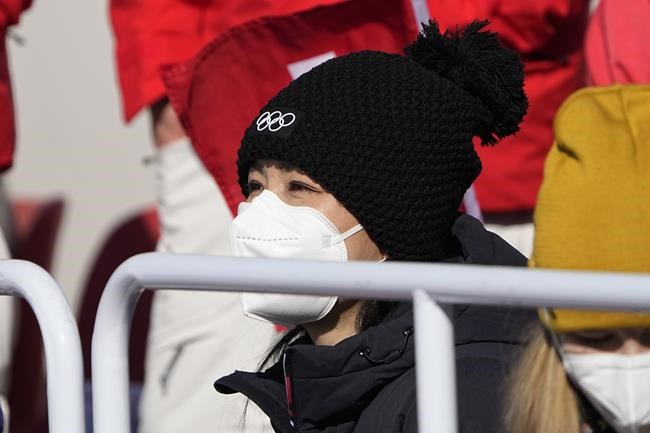China's Peng Shuai, right, watches the women's freestyle skiing big air finals at the 2022 Winter Olympics, Tuesday, Feb. 8, 2022, in Beijing. (AP Photo/Jae C. Hong)