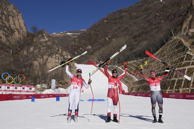 From left, Ryan Cochran-Siegle of the United States, silver, Matthias Mayer of Austria, gold, and Aleksander Aamodt Kilde of Norway, bronze, celebrate during the medal ceremony for the men's super-G at the 2022 Winter Olympics in the Yanqing district of Beijing, Tuesday, Feb. 8, 2022. THE CANADIAN PRESS/AP-Luca Bruno