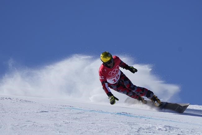 Austria's Benjamin Karl competes during the men's parallel giant slalom elimination run at the 2022 Winter Olympics, Tuesday, Feb. 8, 2022, in Zhangjiakou, China. (AP Photo/Lee Jin-man)