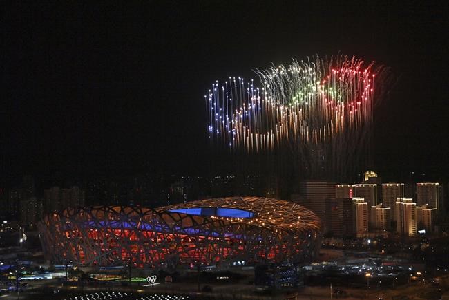 Fireworks, forming the Olympic rings, illuminate the sky during the opening ceremony of the 2022 Winter Olympics, Friday, Feb. 4, 2022, in Beijing. (Li Xin/Xinhua via AP)