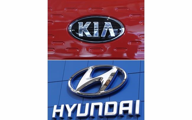 FILE- This combination of file photos shows the logo of Kia Motors Dec. 13, 2017, in Seoul, South Korea, top, and Hyundai logo April 15, 2018, in the south Denver suburb of Littleton, Colo., bottom. Hyundai and Kia are telling the owners of nearly 485,000 vehicles in the U.S., Tuesday, Feb. 8, 2022, to park them outdoors because they can catch fire. (AP Photo, File)