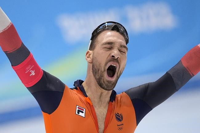 Kjeld Nuis of the Netherlands celebrates after breaking an Olympic record during the men's speedskating 1,500-meter race at the 2022 Winter Olympics, Tuesday, Feb. 8, 2022, in Beijing. His time stood for the gold medal. (AP Photo/Sue Ogrocki)
