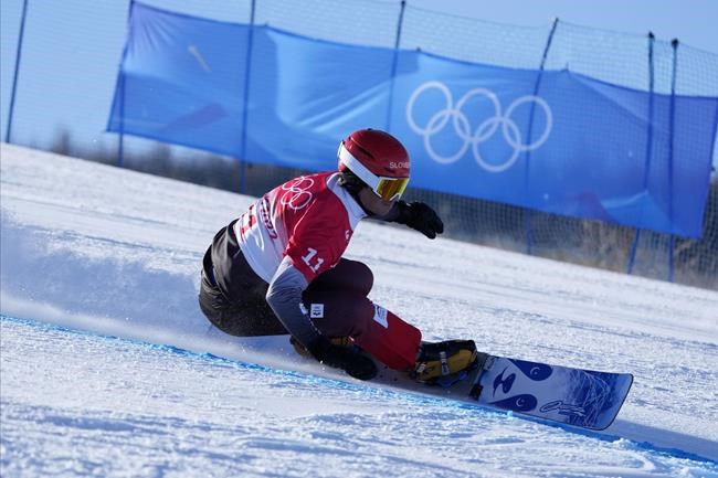 Slovenia's Zan Kosir competes during the men's parallel giant slalom finals at the 2022 Winter Olympics, Tuesday, Feb. 8, 2022, in Zhangjiakou, China. (AP Photo/Lee Jin-man)