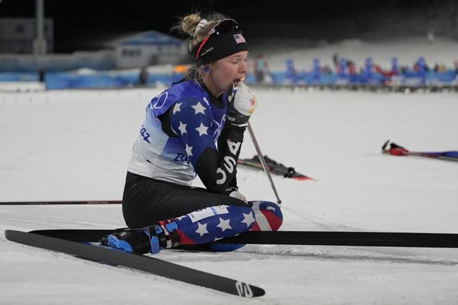 Jessie Diggins reacts after a bronze medal finish at the women's final sprint free cross-country skiing competition at the 2022 Winter Olympics, Tuesday, Feb. 8, 2022, in Zhangjiakou, China. (AP Photo/Alessandra Tarantino)