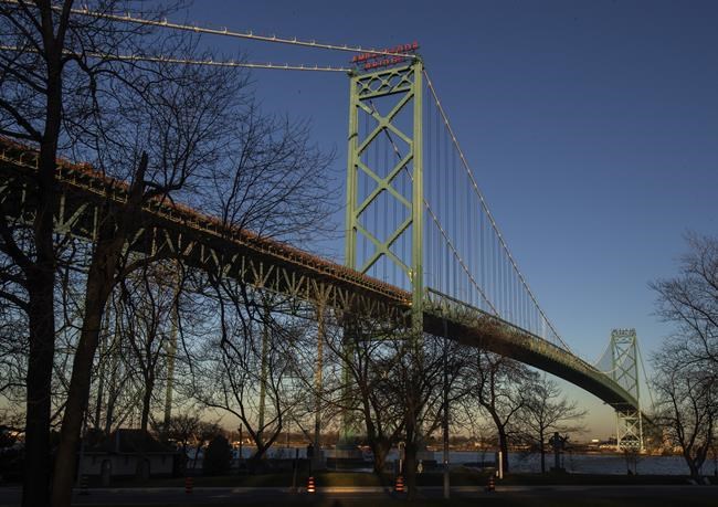 The Ambassador bridge which spans the Detroit River between Windsor and Detroit, Michigan, is shown from Windsor, Ont., on Saturday, December 18, 2021.THE CANADIAN PRESS/Fred Thornhill