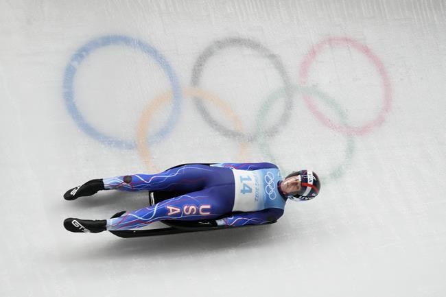 Emily Sweeney, of the United States, slides during the luge women's singles run 3 at the 2022 Winter Olympics, Tuesday, Feb. 8, 2022, in the Yanqing district of Beijing. (AP Photo/Dmitri Lovetsky)