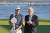 Tom Hoge, left, poses with his trophy along with Clint Eastwood on the 18th green of the Pebble Beach Golf Links after winning the AT&T Pebble Beach Pro-Am golf tournament in Pebble Beach, Calif., Sunday, Feb. 6, 2022. (AP Photo/Eric Risberg)