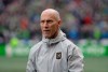 Bob Bradley walks on the pitch before an MLS soccer match against the Seattle Sounders in Seattle, March 4, 2018.&nbsp;With just 14 returning players currently in camp with Toronto FC, new coach Bob Bradley has taken a hammer to his roster as he rebuilds a team that went 6-18-10 last season. THE CANADIAN PRESS/AP-Ted S. Warren