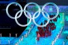Canada flag-bearers Charles Hamelin (left) and Marie-Philip Poulin lead the Canadian athletes as they enter the stadium during the opening ceremony at the Beijing Winter Olympics in Beijing, China, on Friday, Feb. 4, 2022. THE CANADIAN PRESS/Paul Chiasson