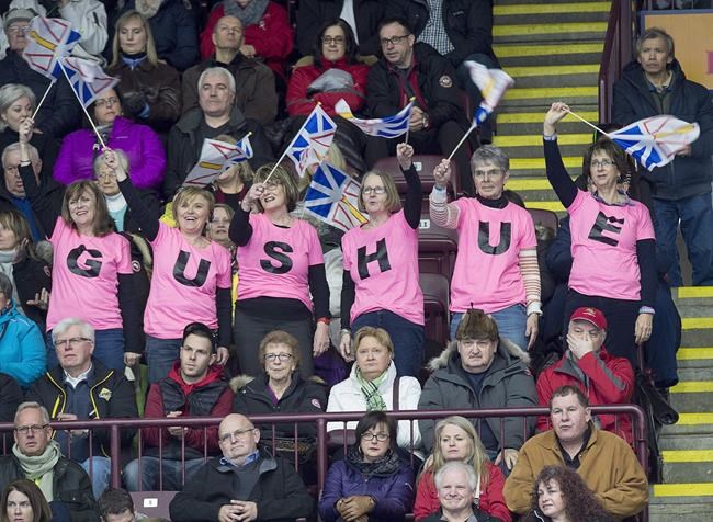 Newfoundland and Labrador skip Brad Gushue fans, known as the Gushue Girls, cheer the hometown hero at the Tim Hortons Brier curling championship at Mile One Centre in St. John's on Saturday, March 4, 2017. THE CANADIAN PRESS/Andrew Vaughan