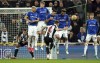 Newcastle United's Kieran Trippier scores their side's third goal of the game from a free-kick, during the English Premier League soccer match between Newcastle United and Everton, at St James' Park, Newcastle, England, Tuesday, Feb. 8, 2022. (Owen Humphreys/PA via AP)